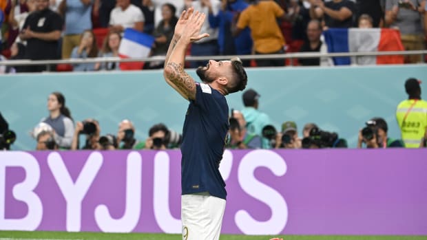 Olivier Giroud pictured celebrating after scoring his 52nd goal for France in December 2022